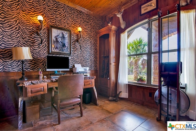 office space featuring built in desk, wood ceiling, and wooden walls