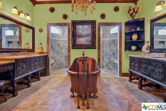 bathroom featuring vanity, crown molding, and separate shower and tub