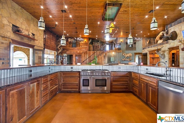 kitchen featuring stainless steel appliances, a towering ceiling, hanging light fixtures, sink, and wooden ceiling