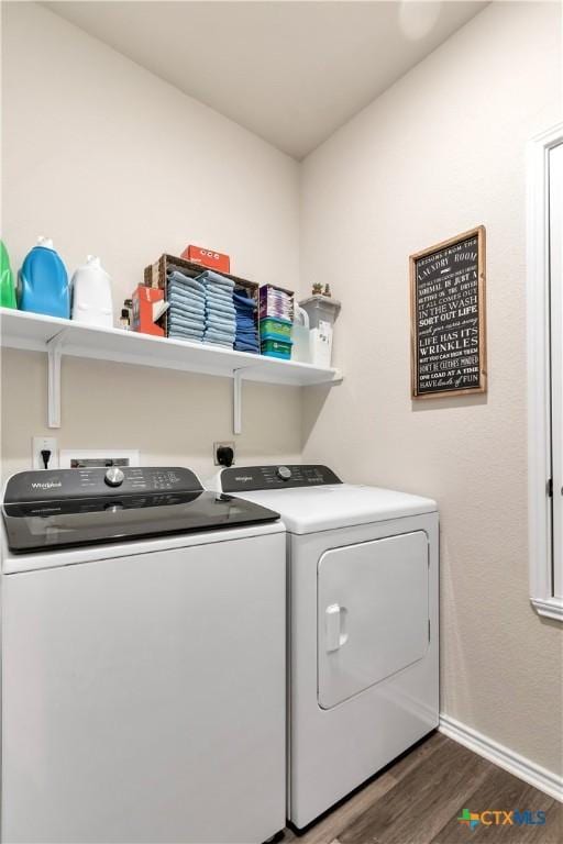 304 Stone Water Ln, Jarrell, TX 76537 - clothes washing area with washer and dryer, wood finished floors, and baseboards
