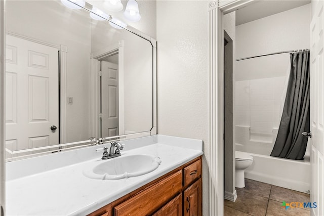 full bath with toilet, shower / bath combo with shower curtain, vanity, and tile patterned floors