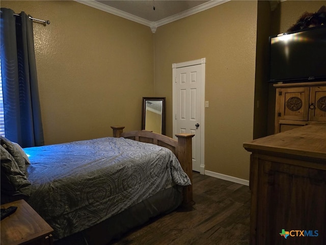 bedroom with dark hardwood / wood-style flooring and ornamental molding