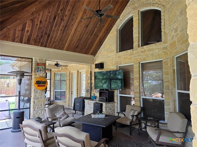 living room with wooden ceiling, a wealth of natural light, ceiling fan, and high vaulted ceiling