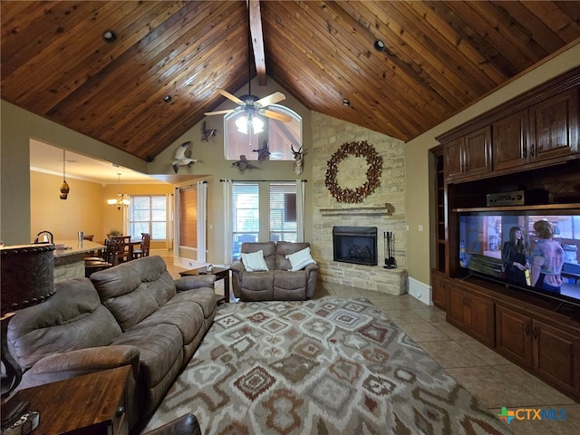 tiled living room featuring ceiling fan with notable chandelier, wooden ceiling, high vaulted ceiling, beam ceiling, and a fireplace