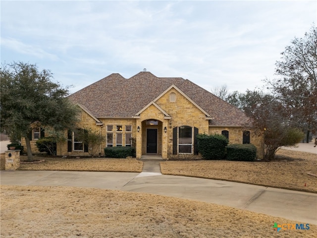 view of front of home with roof with shingles