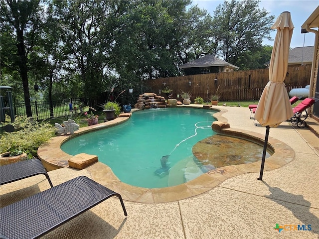 view of pool featuring a patio