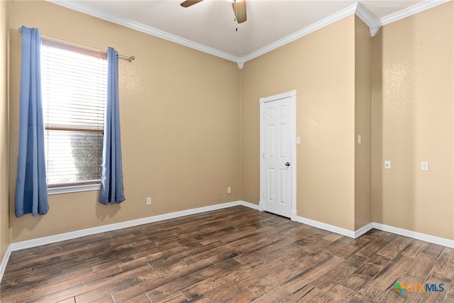 spare room featuring dark wood-style floors, ceiling fan, ornamental molding, and baseboards