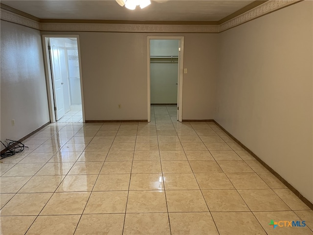 307 Hickok Ct, Austin, TX 78753 - empty room with light tile patterned floors and baseboards