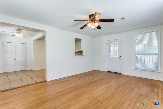 1488 Canyon Edge, Canyon Lake, TX 78133 - entryway featuring a ceiling fan, light wood finished floors, and baseboards