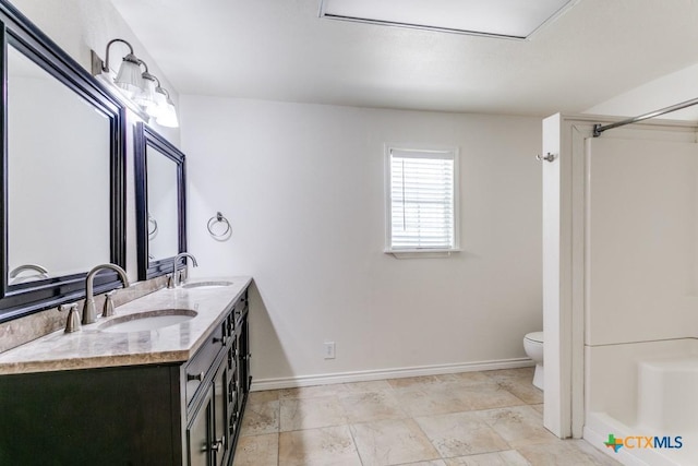 1488 Canyon Edge, Canyon Lake, TX 78133 - full bath featuring toilet, double vanity, baseboards, and a shower