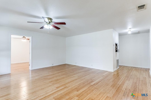 1488 Canyon Edge, Canyon Lake, TX 78133 - empty room featuring ceiling fan, light wood-type flooring, and baseboards