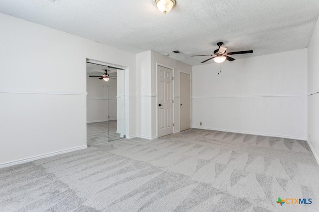 1488 Canyon Edge, Canyon Lake, TX 78133 - spare room with ceiling fan, carpet floors, a textured ceiling, and baseboards