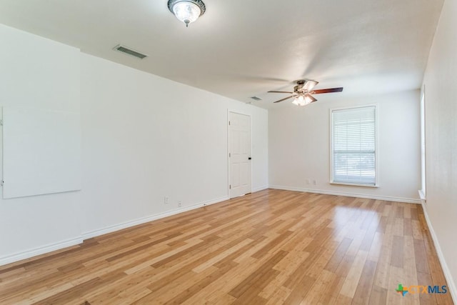 1488 Canyon Edge, Canyon Lake, TX 78133 - spare room featuring ceiling fan, light wood-type flooring, and baseboards