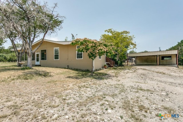 1488 Canyon Edge, Canyon Lake, TX 78133 - view of home's exterior with an outbuilding