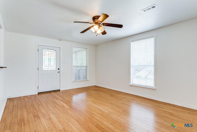1488 Canyon Edge, Canyon Lake, TX 78133 - foyer with light wood-style floors, plenty of natural light, a ceiling fan, and baseboards