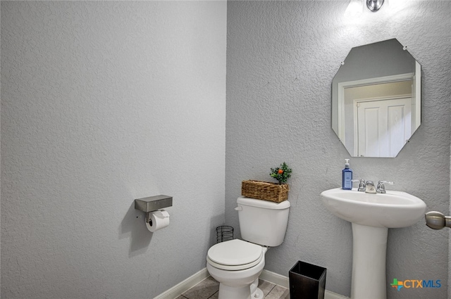 bathroom featuring toilet