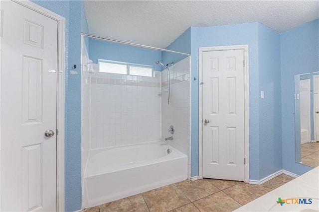 2405 Thoroughbred Dr, Killeen, TX 76549 - bathroom featuring tile patterned floors, baseboards, washtub / shower combination, and a textured ceiling