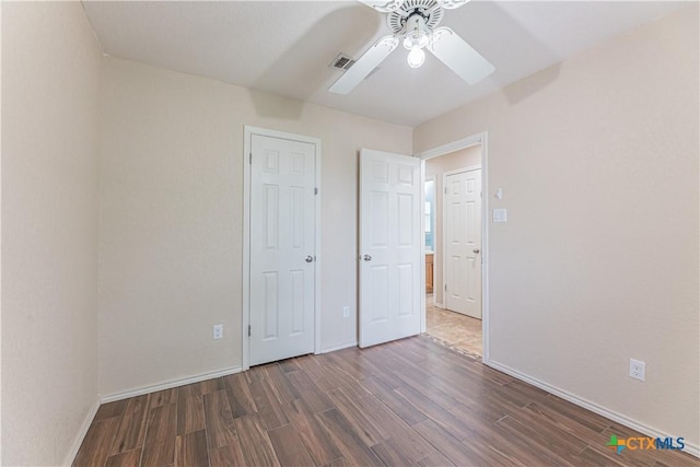 2405 Thoroughbred Dr, Killeen, TX 76549 - unfurnished bedroom with wood finished floors, visible vents, a ceiling fan, and baseboards