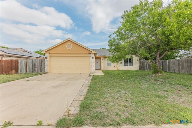 2405 Thoroughbred Dr, Killeen, TX 76549 - ranch-style house featuring a front lawn, driveway, fence, a garage, and brick siding