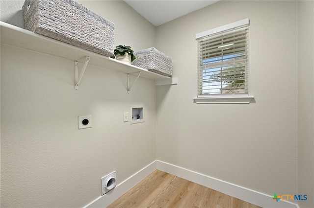 washroom with electric dryer hookup, washer hookup, and wood-type flooring