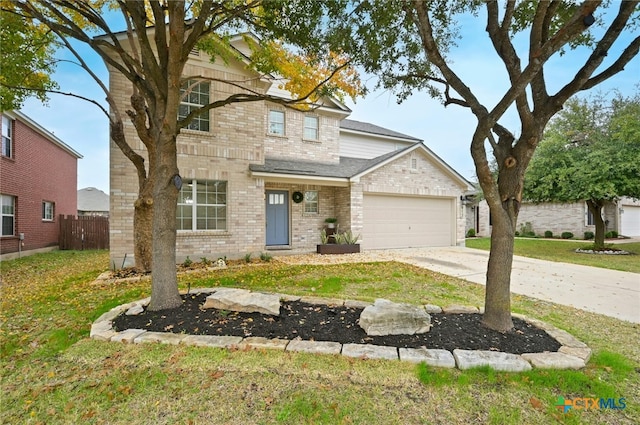 front facade with a front lawn and a garage