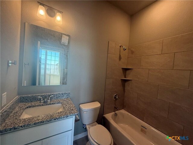 unfurnished bedroom with a textured ceiling, light colored carpet, ceiling fan, and connected bathroom