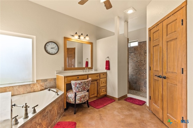 full bath with a tile shower, vanity, a garden tub, and a ceiling fan