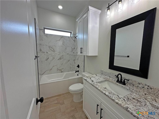 full bathroom with  shower combination, vanity, and toilet