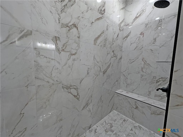 full bathroom with tiled shower