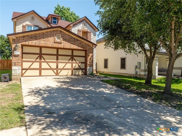 9108 Sage Loop Ct, Temple, TX 76502 - view of front of property featuring stone siding, an attached garage, driveway, and brick siding