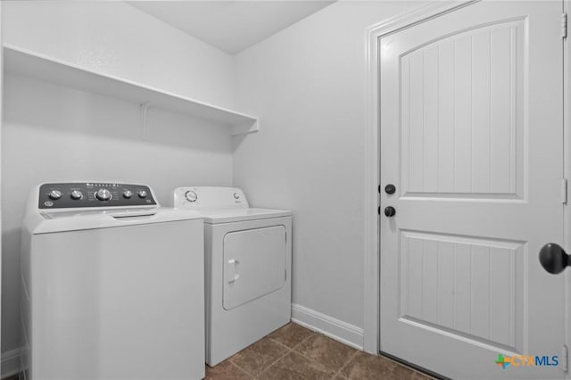 9108 Sage Loop Ct, Temple, TX 76502 - laundry room with washer and dryer and baseboards