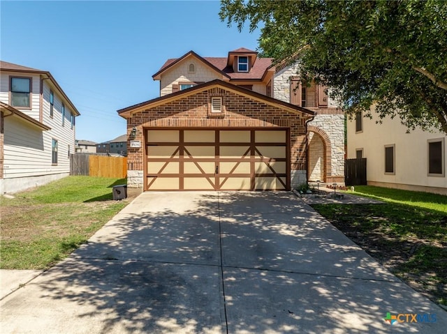 9108 Sage Loop Ct, Temple, TX 76502 - view of front of house featuring stone siding, driveway, an attached garage, and brick siding