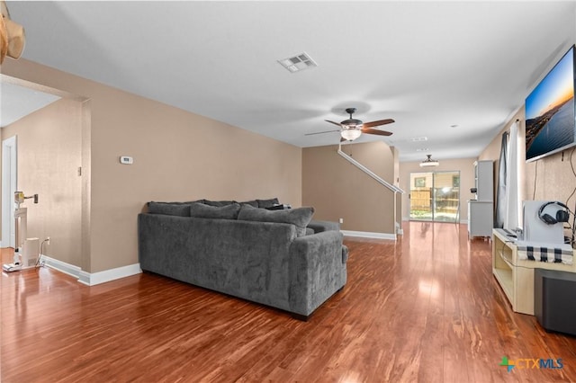 9108 Sage Loop Ct, Temple, TX 76502 - living area featuring wood finished floors, a ceiling fan, and baseboards