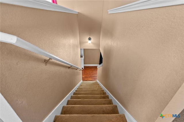 9108 Sage Loop Ct, Temple, TX 76502 - stairs with wood finished floors, baseboards, and a textured wall
