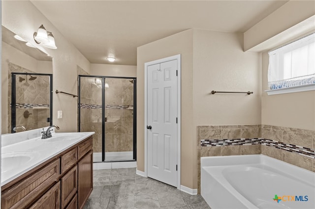 bathroom featuring shower with separate bathtub and vanity