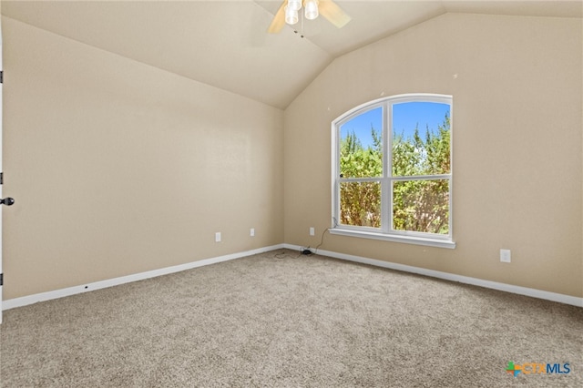 unfurnished room featuring ceiling fan, vaulted ceiling, and carpet