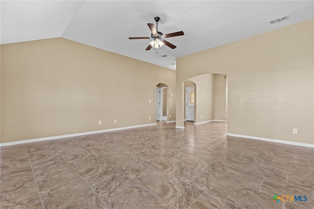 empty room with ceiling fan and lofted ceiling