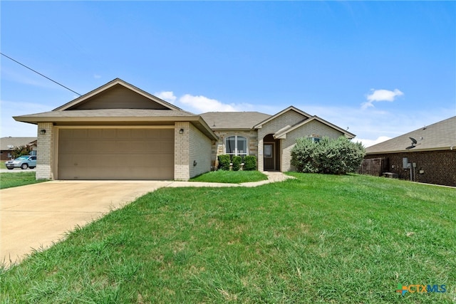 ranch-style house featuring a garage and a front lawn