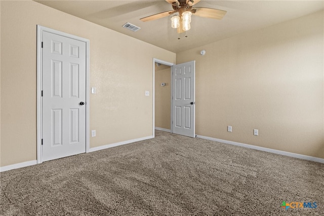 unfurnished bedroom with ceiling fan and carpet