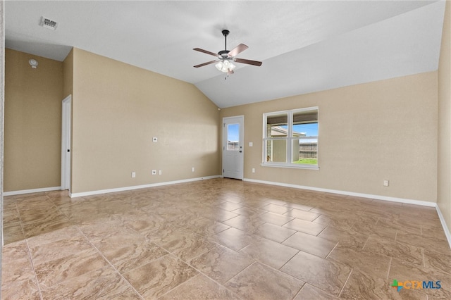 empty room featuring ceiling fan and vaulted ceiling