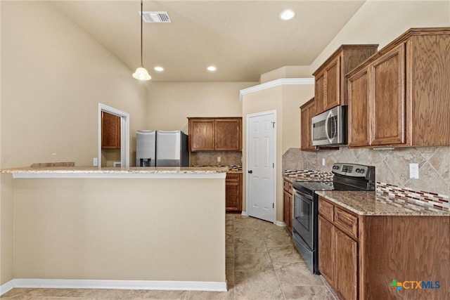 kitchen featuring stainless steel appliances, light stone countertops, decorative light fixtures, and backsplash