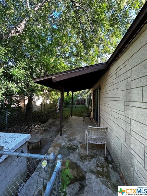 903 N Cherry St, Seguin, TX 78155 - view of patio / terrace with fence