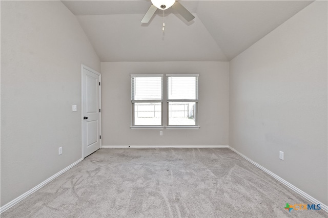 132 Periwinkle Ln, Bastrop, TX 78602 - empty room featuring carpet flooring, ceiling fan, baseboards, and lofted ceiling