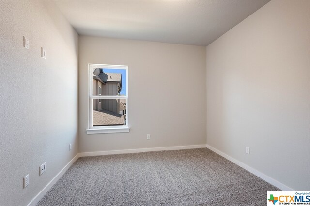 unfurnished room with carpet