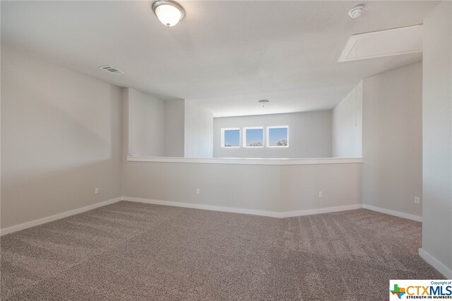 unfurnished room with carpet flooring