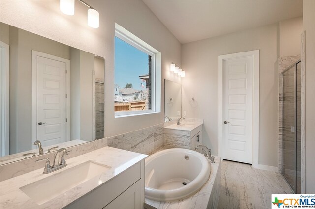 bathroom with shower with separate bathtub and vanity