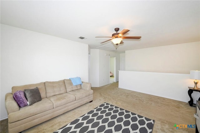 carpeted living room featuring ceiling fan