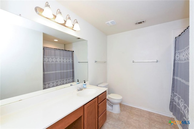 bathroom featuring toilet, vanity, and a shower with curtain