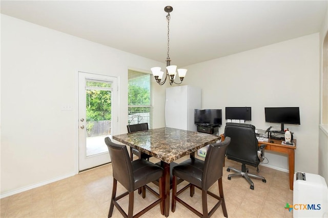 dining area with a chandelier