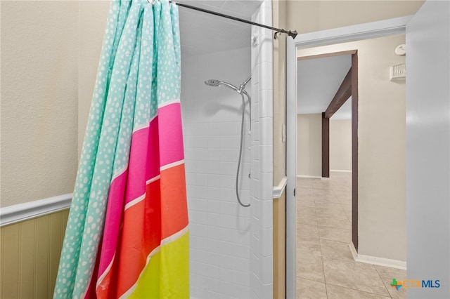 bathroom featuring tile patterned flooring and a shower with curtain